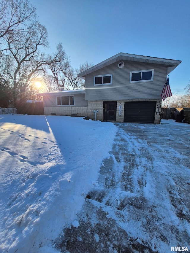 view of front of property with a garage