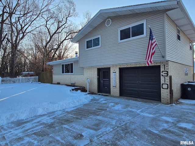 view of front of property with a garage