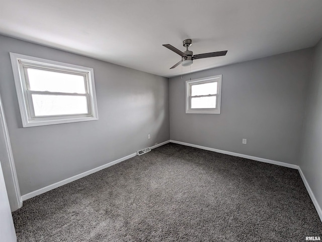 carpeted empty room featuring ceiling fan