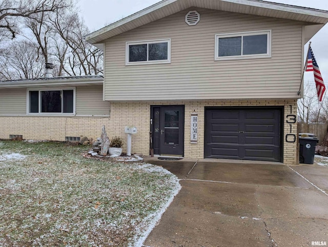 split level home featuring a garage