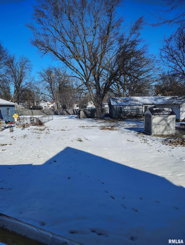 view of yard layered in snow