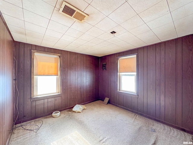 unfurnished room with light colored carpet