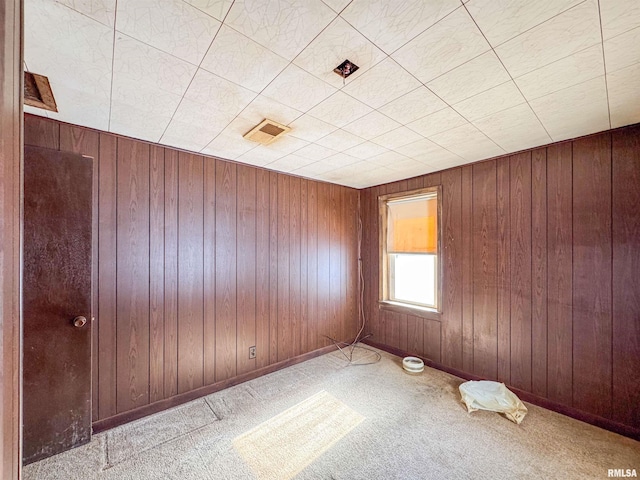 unfurnished room with light colored carpet