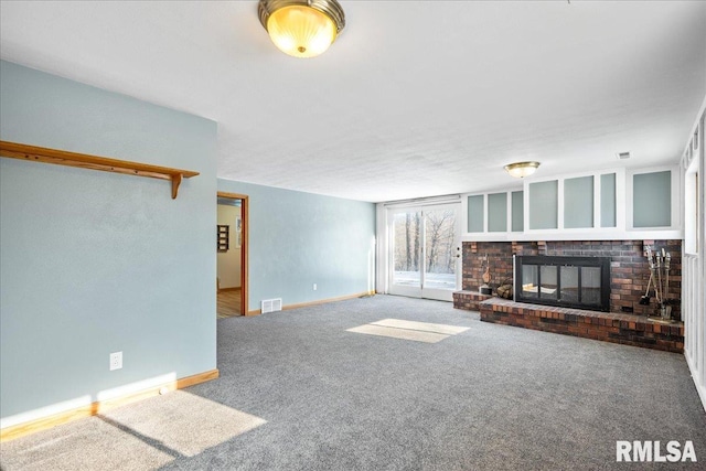 unfurnished living room with a fireplace and carpet floors