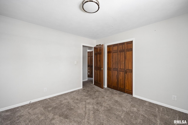 unfurnished bedroom with carpet flooring and a closet