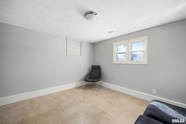 unfurnished room featuring light carpet