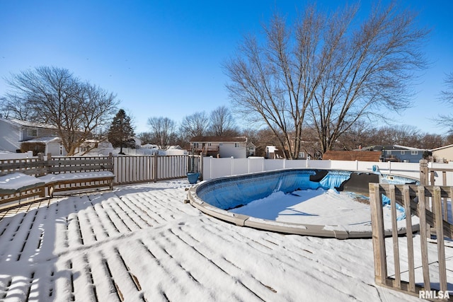 view of snow covered pool