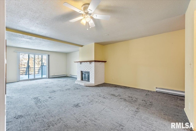 unfurnished living room featuring carpet flooring, a textured ceiling, a tiled fireplace, ceiling fan, and baseboard heating