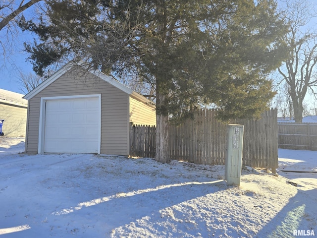 view of snow covered garage