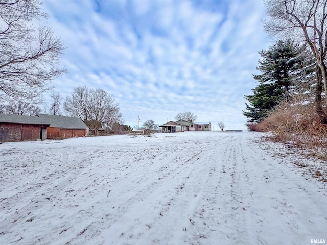 view of yard covered in snow