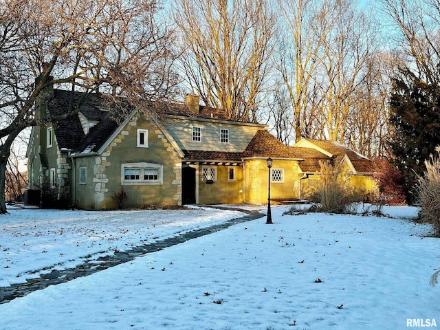 view of snow covered house