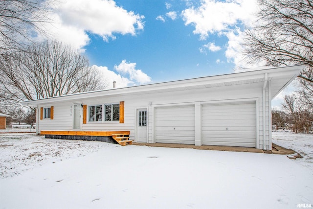 single story home featuring a garage