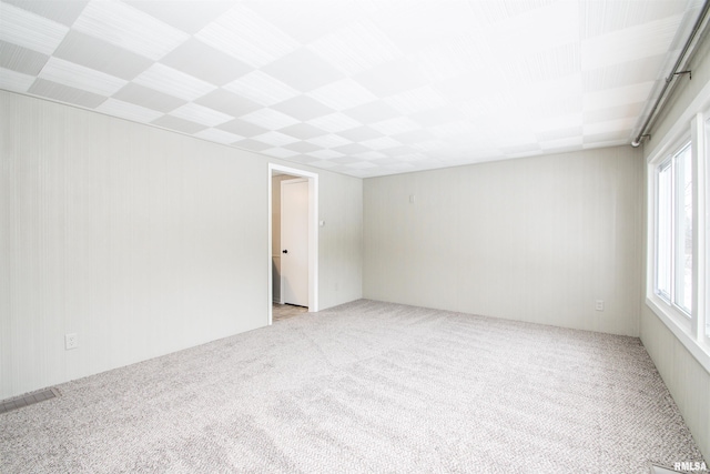 unfurnished room with light carpet