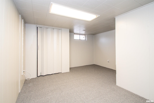 basement with light colored carpet