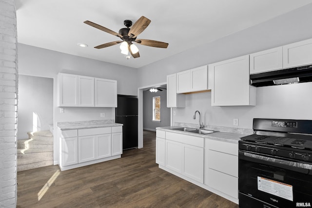 kitchen featuring white cabinetry, dark hardwood / wood-style floors, sink, and black appliances