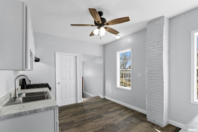 kitchen featuring dark hardwood / wood-style flooring, sink, white cabinetry, and ceiling fan