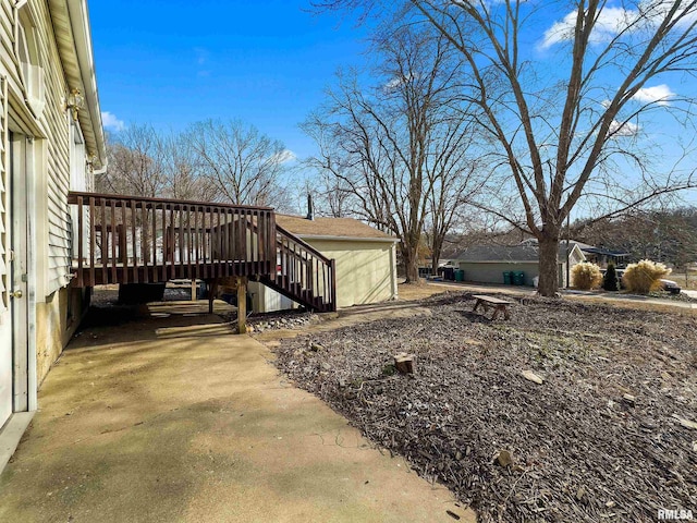 view of side of home with a deck