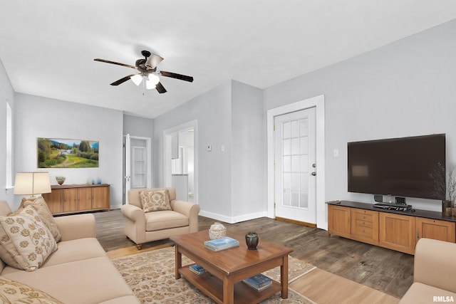 living room with hardwood / wood-style flooring and ceiling fan