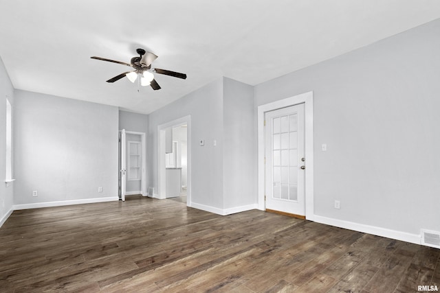 empty room featuring dark hardwood / wood-style floors and ceiling fan