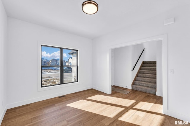 unfurnished room featuring light hardwood / wood-style flooring