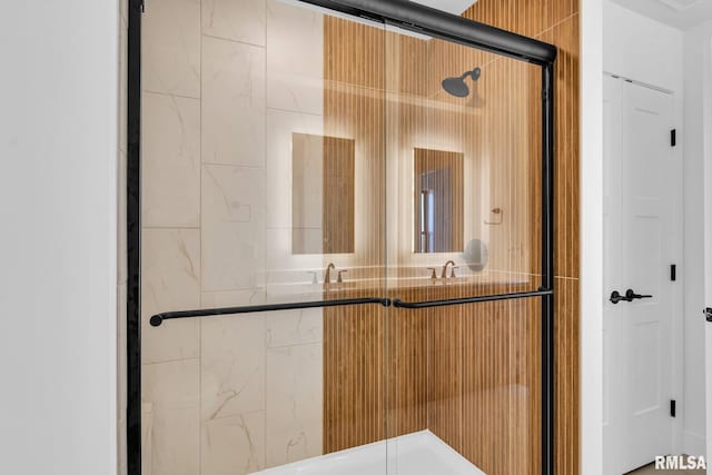 bathroom featuring an enclosed shower