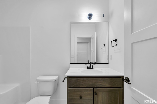 bathroom featuring vanity and toilet