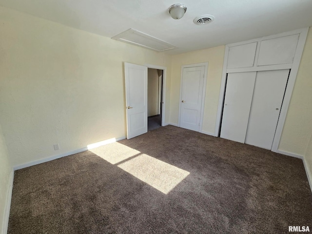 unfurnished bedroom with a closet and carpet