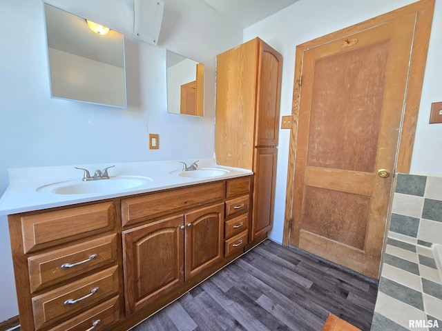 bathroom featuring hardwood / wood-style flooring and vanity