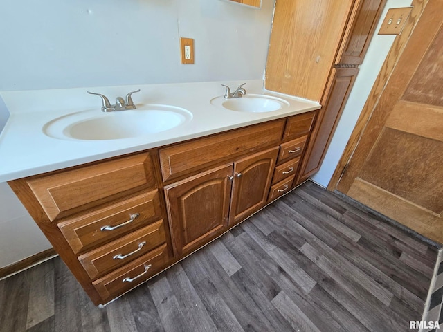 bathroom featuring hardwood / wood-style floors and vanity