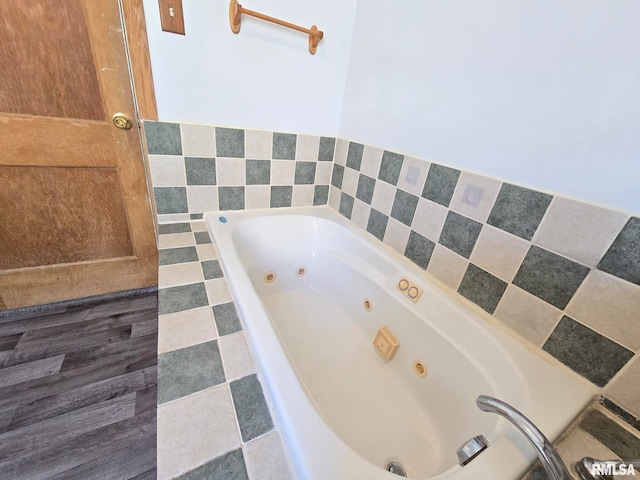 bathroom with tiled tub