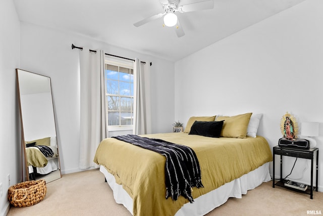 bedroom featuring ceiling fan and light colored carpet