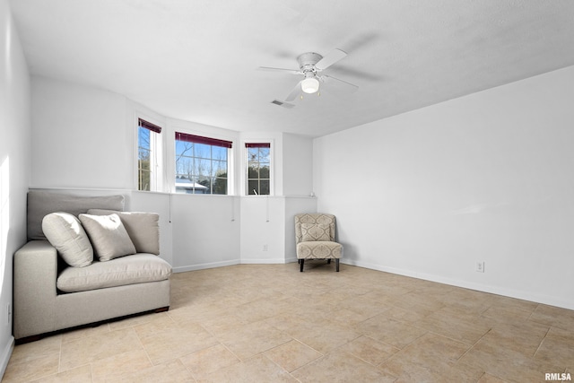 sitting room with ceiling fan