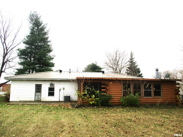 rear view of house with a lawn