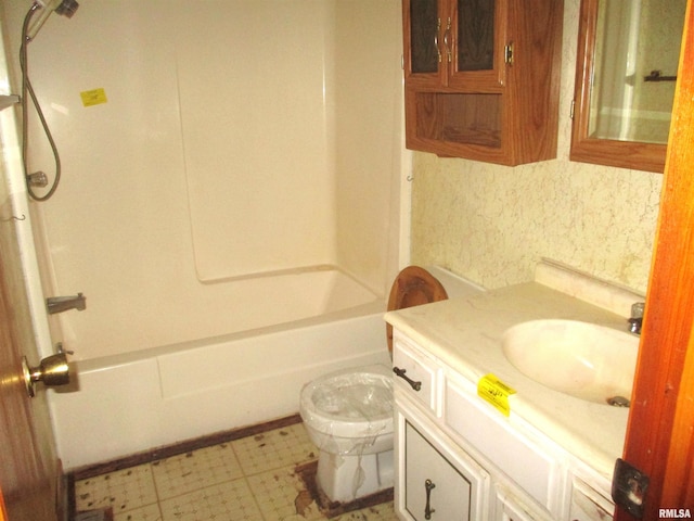 full bathroom featuring toilet, vanity, and shower / bathtub combination