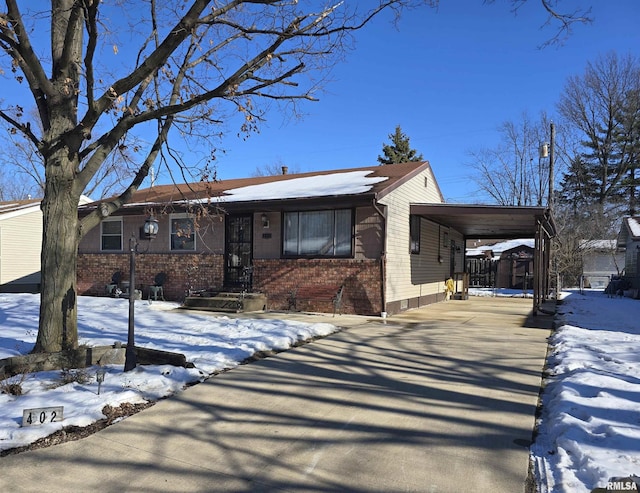 view of front of home with a carport