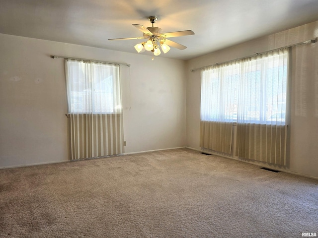 carpeted empty room with ceiling fan