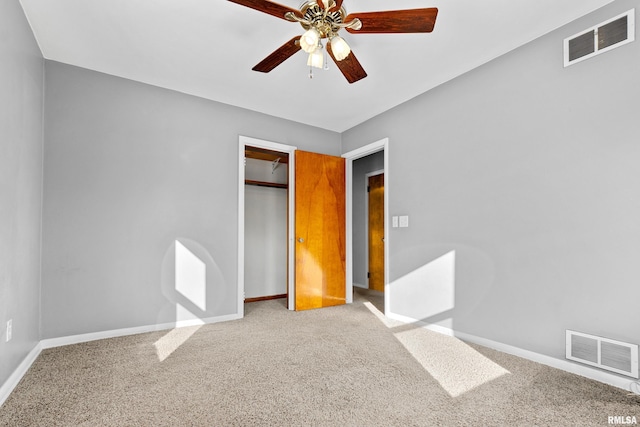 unfurnished bedroom with a closet, ceiling fan, and carpet flooring