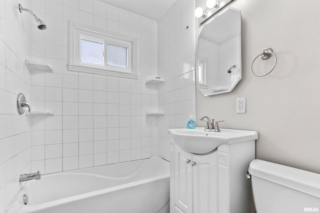 full bathroom featuring vanity, toilet, and tiled shower / bath combo