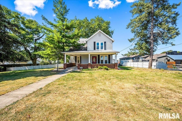 view of front of house with a porch and a front yard