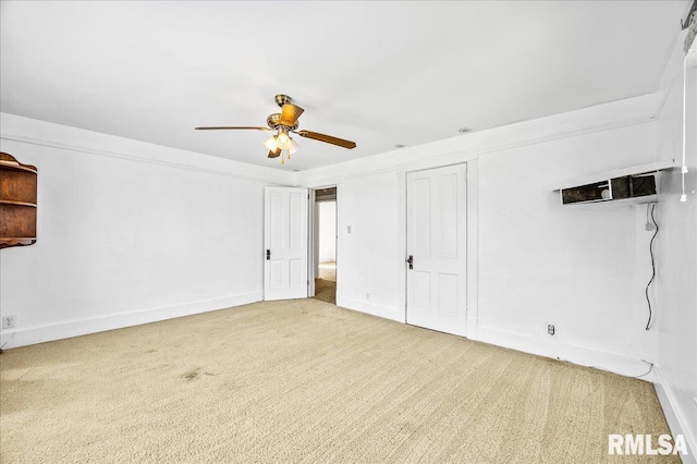 unfurnished bedroom featuring ceiling fan and carpet flooring