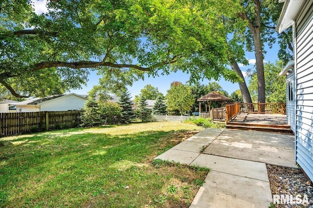 view of yard with a deck and a gazebo