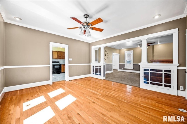 unfurnished living room featuring crown molding and wood-type flooring