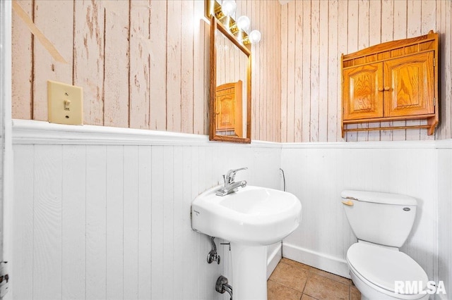 bathroom featuring tile patterned floors and toilet