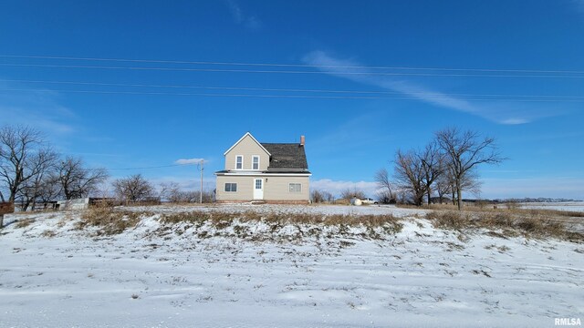 view of snow covered house