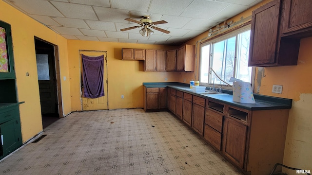 kitchen with ceiling fan and sink