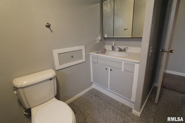 bathroom with toilet and vanity