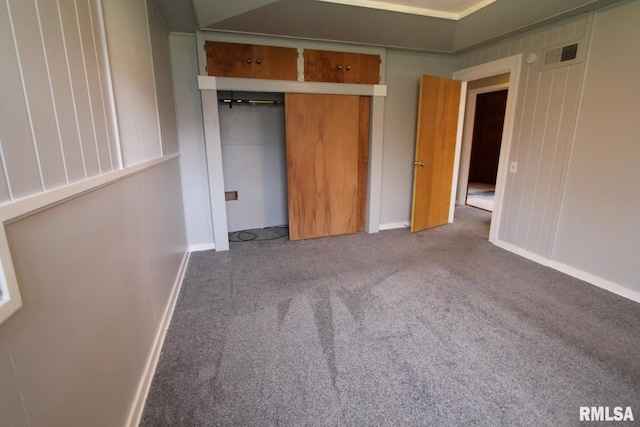 unfurnished bedroom featuring a closet and carpet floors