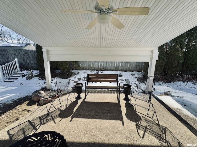 snow covered patio with ceiling fan