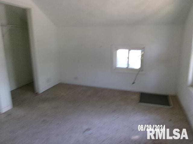 bonus room featuring vaulted ceiling