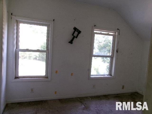 bonus room featuring vaulted ceiling